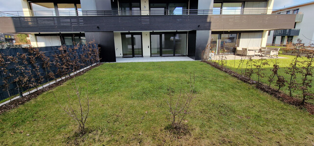 Neubau Gartenwohnung mit 20 m² Terrasse, 70 m² Garten,  6 m² Kellerabteil, 1 Tiefgaragenstellplatz à 20.000,00 e (Kauf)