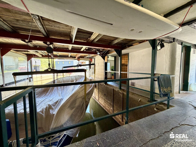 Ferienhaus mit Bootsgarage inklusive Motorboot