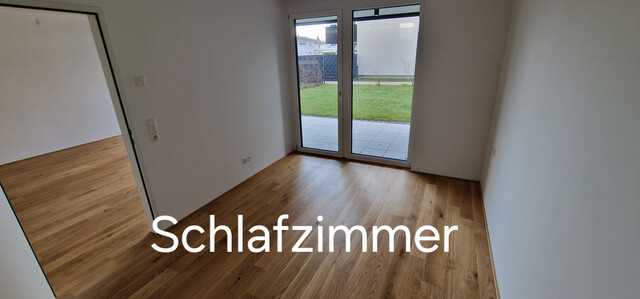 Neubau Gartenwohnung mit 20 m² Terrasse, 70 m² Garten,  6 m² Kellerabteil, 1 Tiefgaragenstellplatz à 20.000,00 e (Kauf)